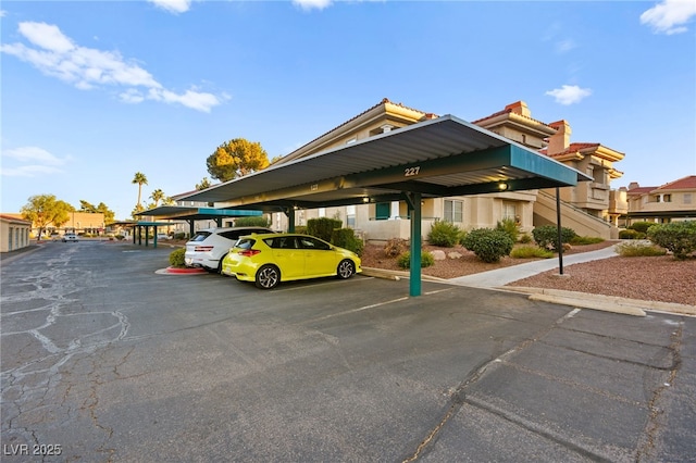 view of partially covered parking lot