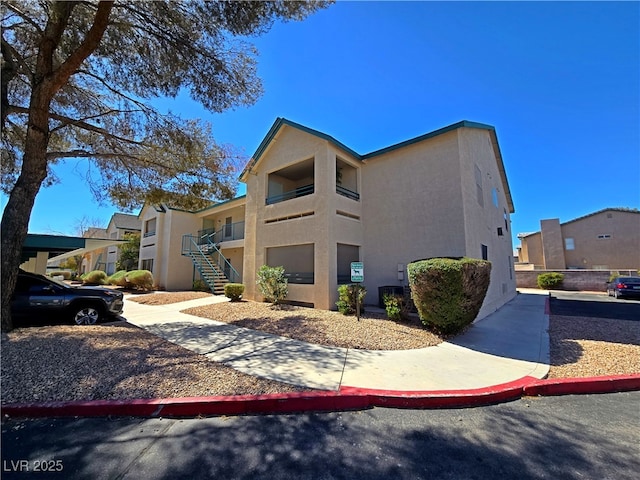 exterior space featuring a residential view and stairs