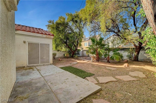 view of yard featuring a patio area and a fenced backyard