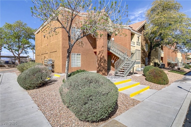 view of property featuring stairs