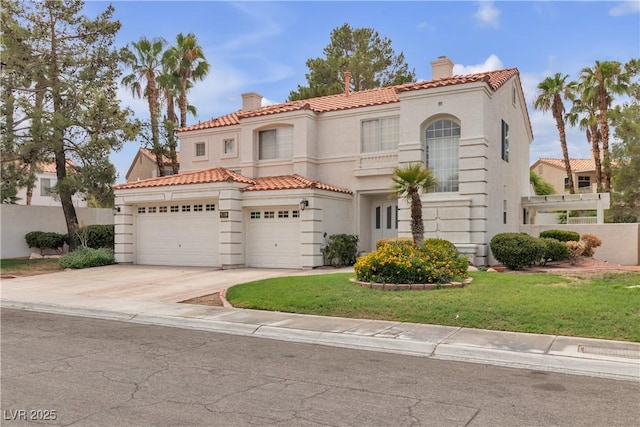 mediterranean / spanish house with stucco siding, a tiled roof, concrete driveway, and a chimney