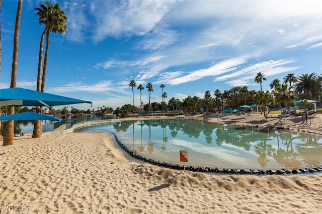 view of swimming pool featuring a water view