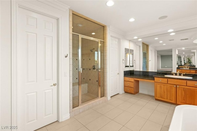 bathroom with tile patterned flooring, a shower stall, ornamental molding, recessed lighting, and vanity