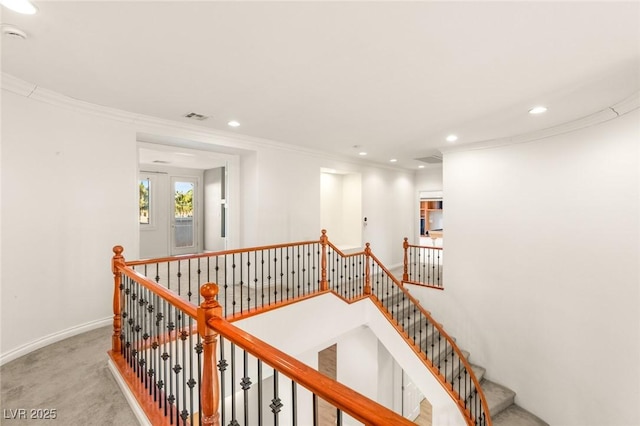 staircase with visible vents, recessed lighting, carpet, and ornamental molding