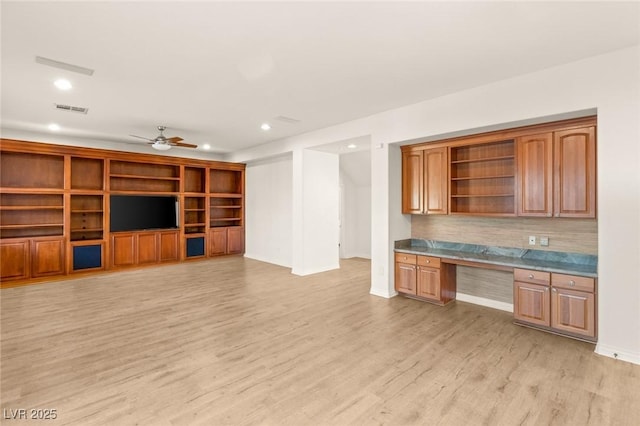 interior space featuring visible vents, recessed lighting, light wood-style floors, built in study area, and a ceiling fan