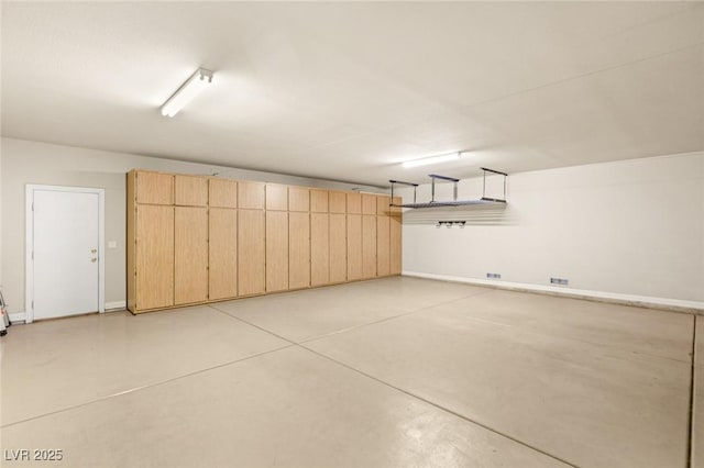 garage featuring baseboards