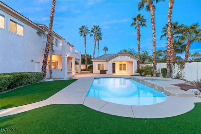 view of pool featuring a lawn, a storage structure, an outdoor structure, an in ground hot tub, and a patio area