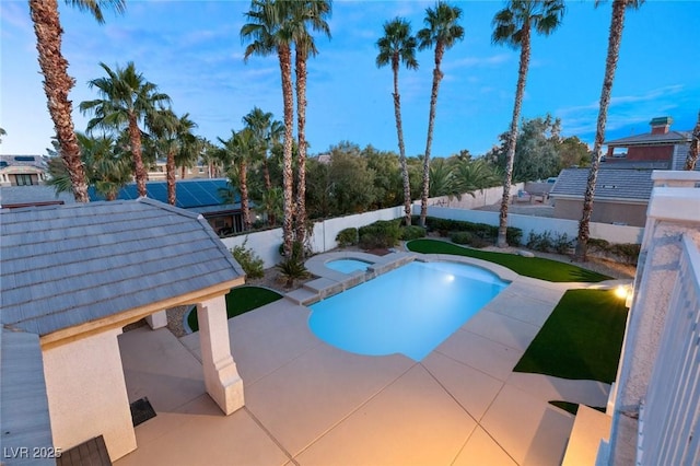 view of pool featuring an in ground hot tub, a fenced backyard, and a patio area