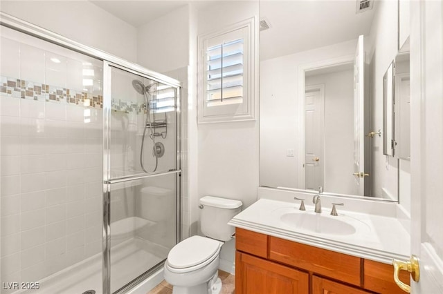 full bath featuring visible vents, a shower stall, toilet, and vanity