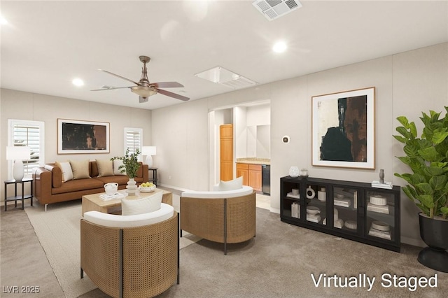 living room with recessed lighting, visible vents, light colored carpet, and ceiling fan