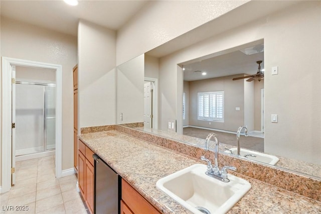 bathroom featuring vanity, a ceiling fan, baseboards, a stall shower, and tile patterned floors