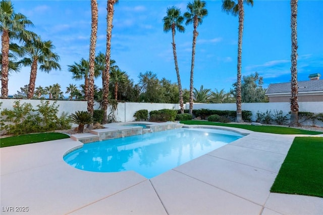 view of pool with a fenced in pool, an in ground hot tub, a fenced backyard, and a patio area