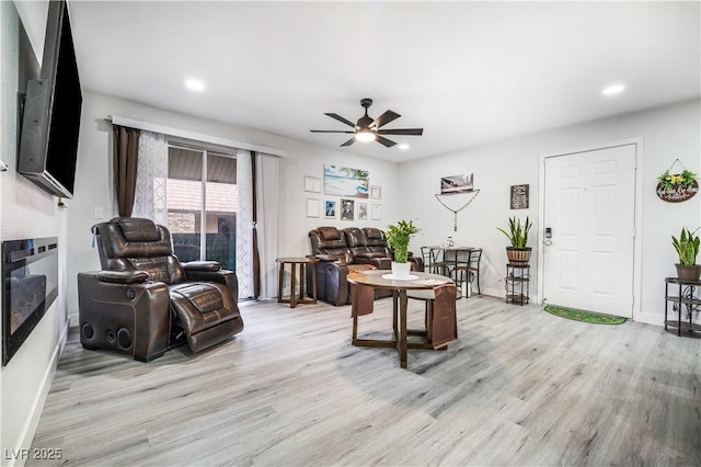 office featuring a ceiling fan, recessed lighting, baseboards, and light wood-type flooring