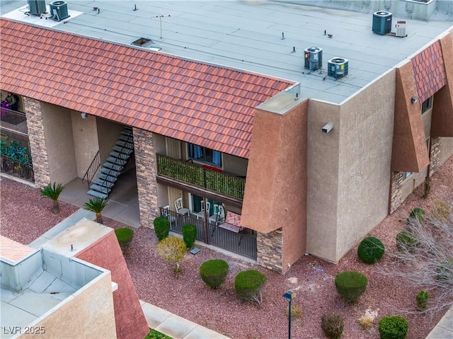 exterior space featuring stairway and fence