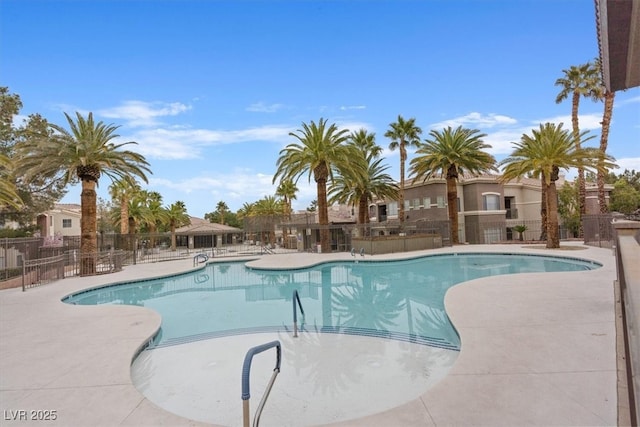 pool featuring a patio and fence