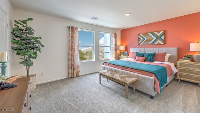 bedroom with carpet flooring, visible vents, and baseboards