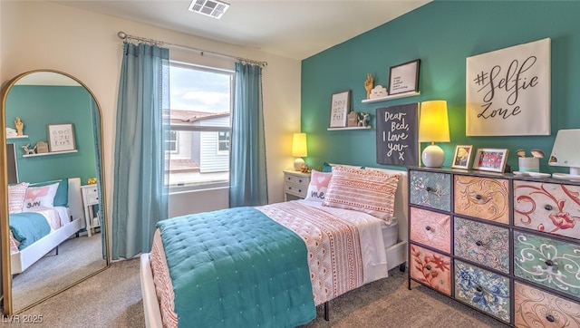 carpeted bedroom with visible vents