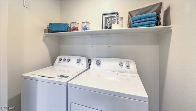 washroom featuring washer and clothes dryer