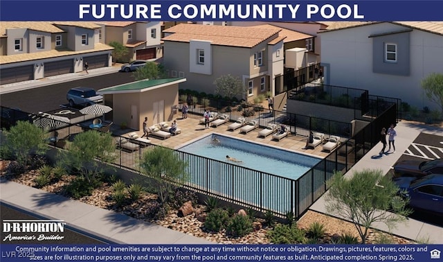 pool with a patio, fence, and a residential view