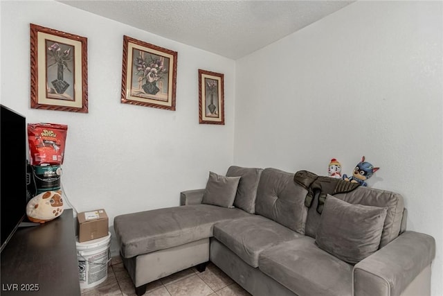 living room with light tile patterned flooring and a textured ceiling