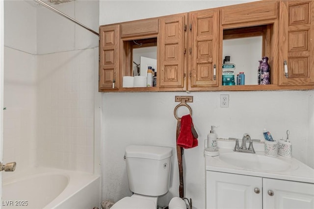 bathroom featuring shower / washtub combination, toilet, and vanity