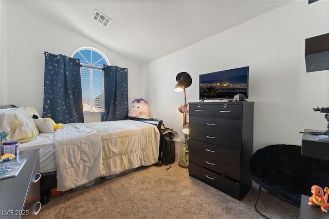 bedroom with vaulted ceiling, visible vents, and light carpet