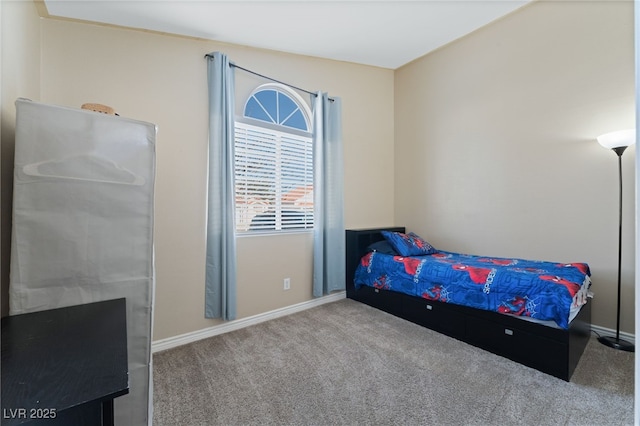 bedroom with carpet flooring and baseboards