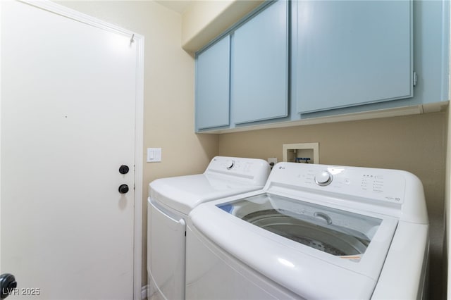 laundry room with cabinet space and independent washer and dryer