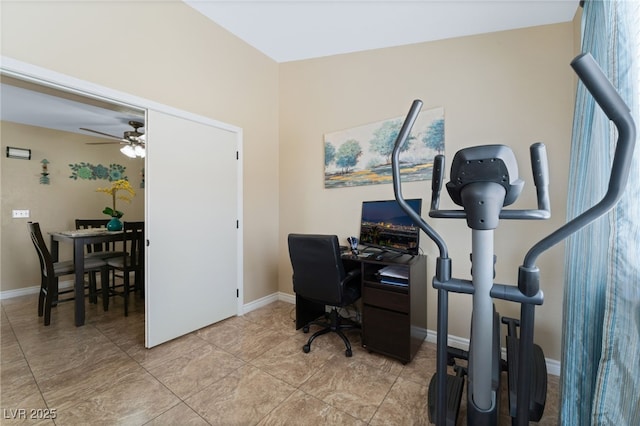 office space featuring baseboards and ceiling fan