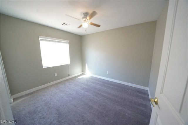 empty room with a ceiling fan, carpet flooring, baseboards, and visible vents