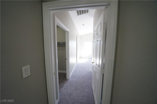 hallway with visible vents and carpet floors