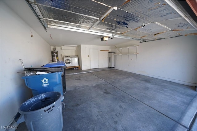 garage with washer and clothes dryer, water heater, and a garage door opener