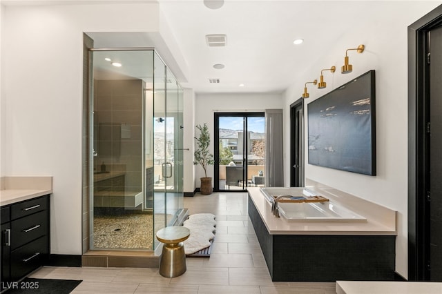 full bath with recessed lighting, visible vents, vanity, and a shower stall