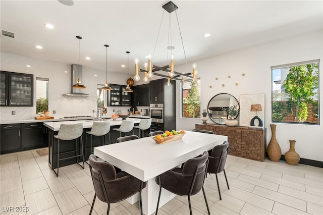 dining area with recessed lighting and visible vents