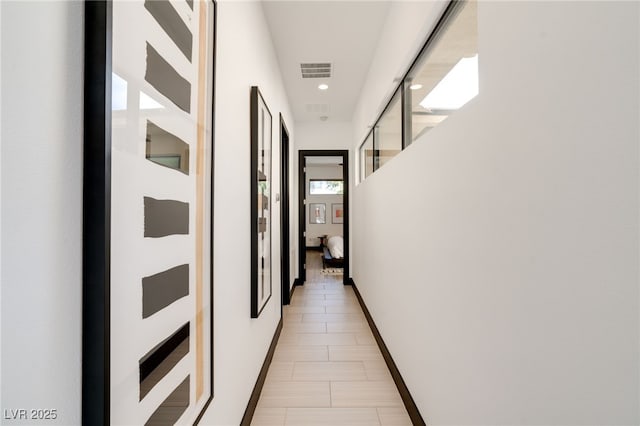 hallway with recessed lighting, baseboards, and visible vents