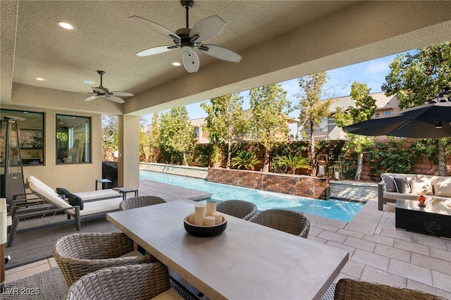 view of patio / terrace featuring an outdoor living space, an outdoor pool, and a fenced backyard