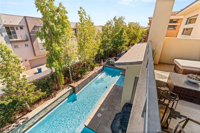 view of swimming pool featuring a fenced in pool