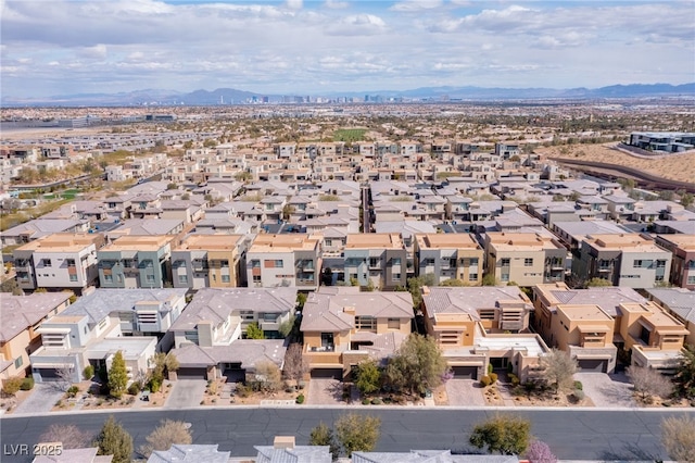 aerial view featuring a mountain view and a residential view