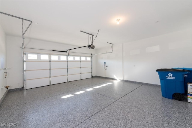 garage featuring baseboards and a garage door opener