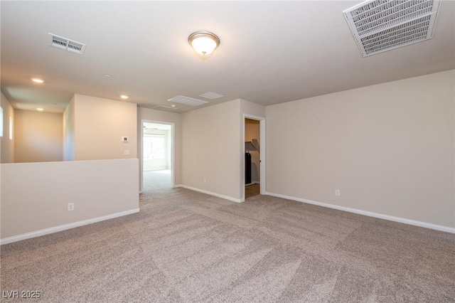 empty room with recessed lighting, visible vents, carpet flooring, and baseboards