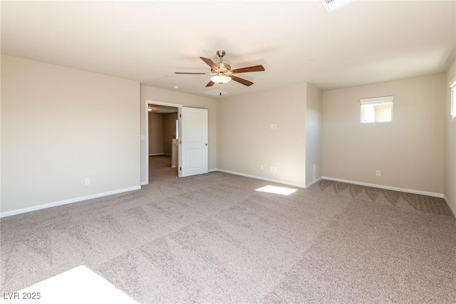 carpeted empty room with baseboards and ceiling fan