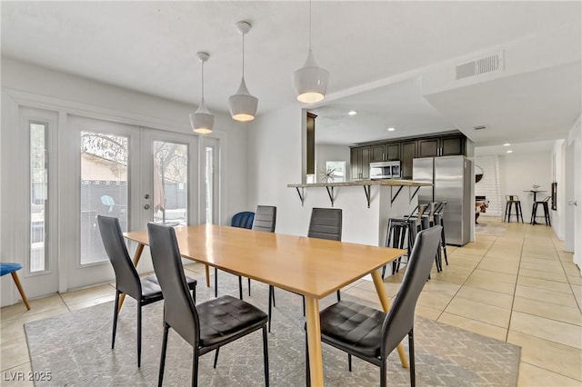 dining room featuring recessed lighting, visible vents, light tile patterned flooring, and french doors