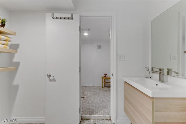 bathroom with visible vents and vanity