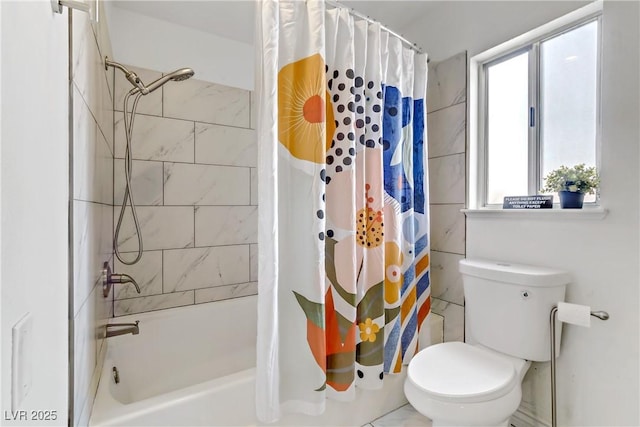 bathroom featuring shower / bath combo with shower curtain and toilet