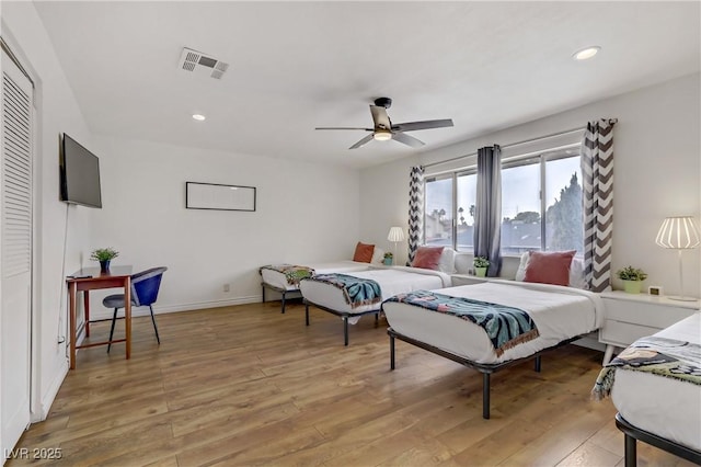 bedroom with visible vents, recessed lighting, baseboards, and light wood-style floors