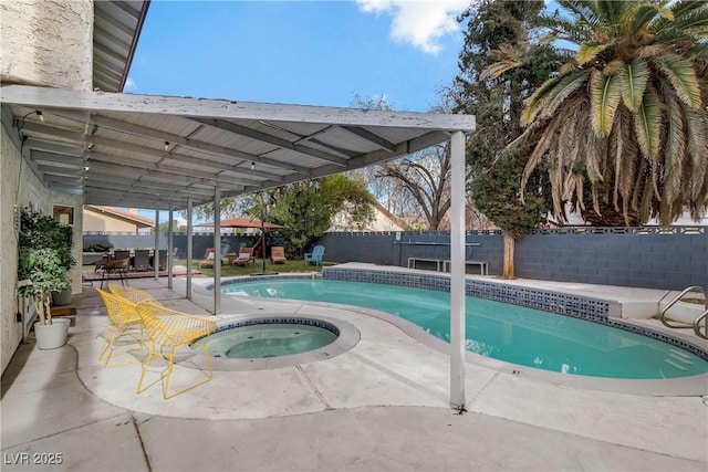 view of swimming pool featuring a patio area, a fenced in pool, an in ground hot tub, and a fenced backyard