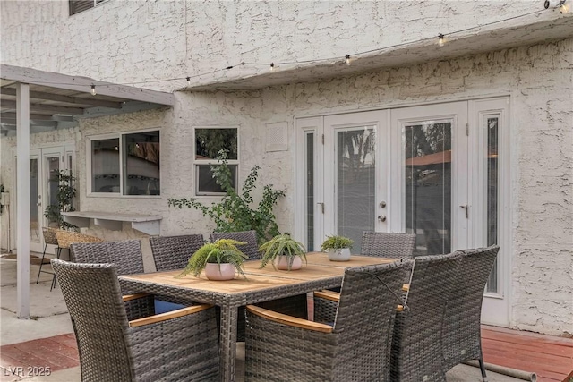 view of patio with french doors and outdoor dining space