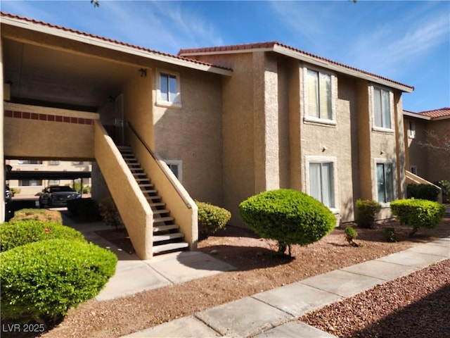 view of property featuring stairway