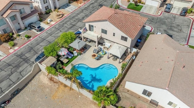 birds eye view of property with a residential view