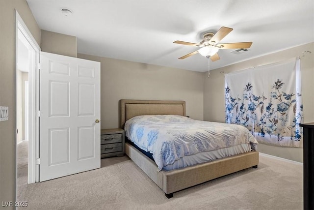 carpeted bedroom with visible vents and ceiling fan